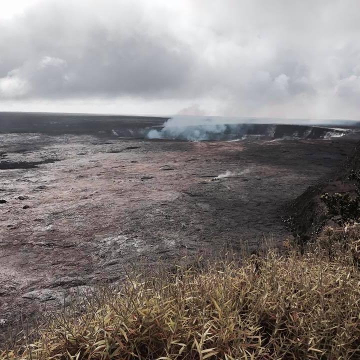 Photo of Halema`uma`u Crater sending up clouds of smoke, Big Island, Hawai`i.